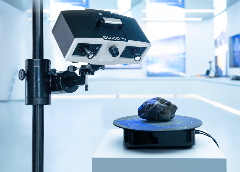 SHINING 3D OptimScan 5M Plus benchtop blue-LED metrology scanner scanning a part on a turntable