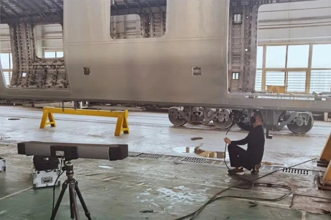 FreeScan Trak Series performing weld quality inspection on railway train body structure for CAD deviation analysis