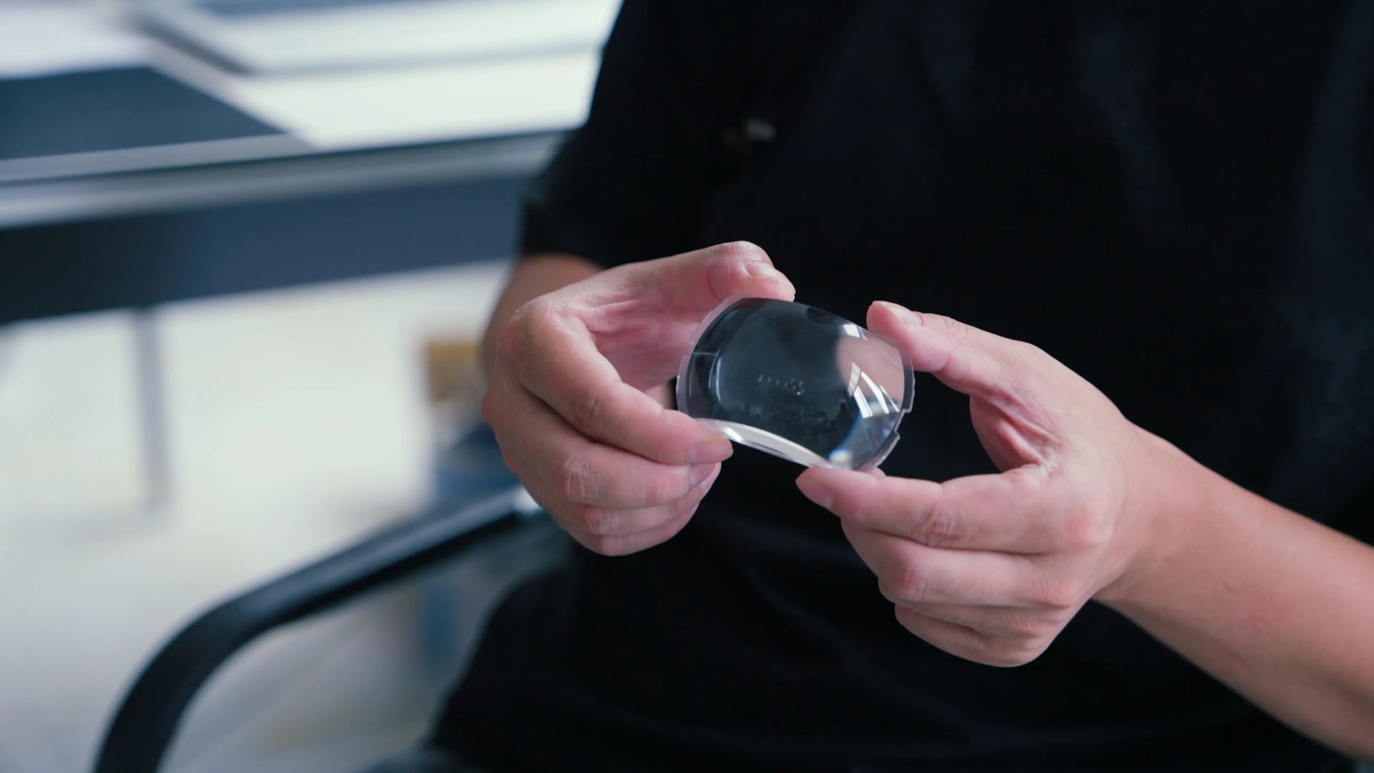 Lens: an irregular curved front surface is clearly visible.